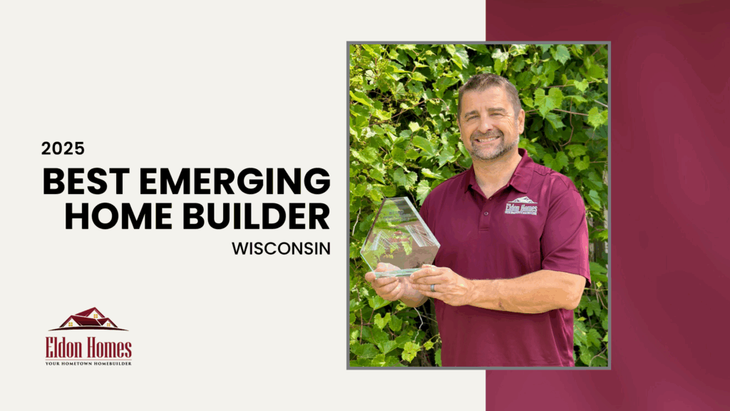 Rob Hostrawser holding the 2025 Best Emerging Builder - Wisconsin Award