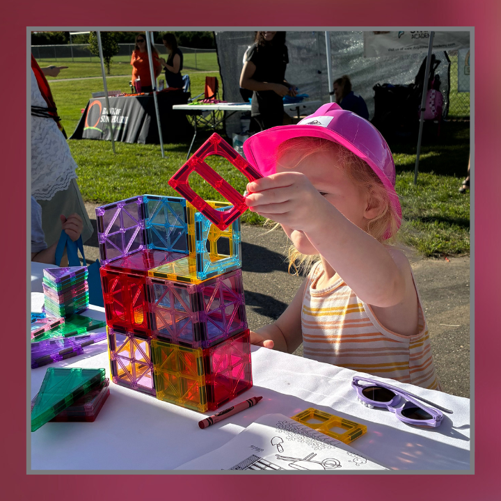 Kid building with blocks at Eldon Homes booth